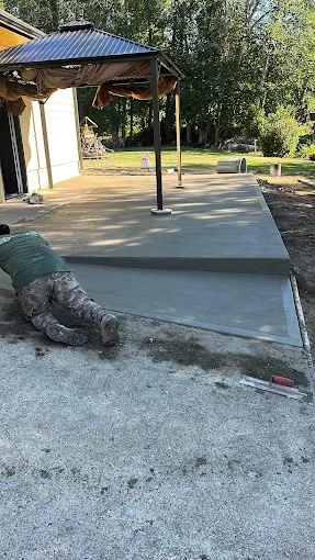 Freshly poured concrete patio slab finished by hand